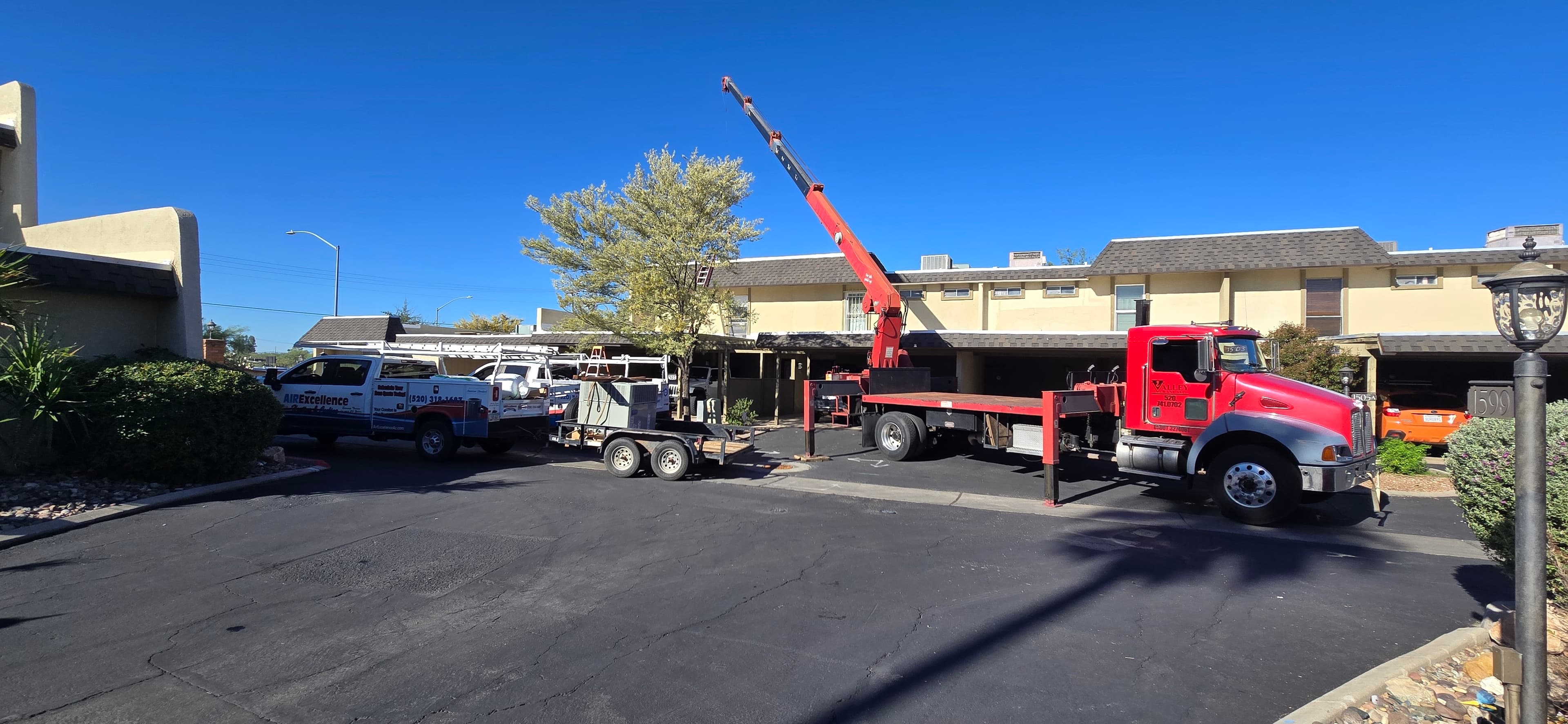 Air Excellence crew installing a rooftop HVAC system at a Tucson home